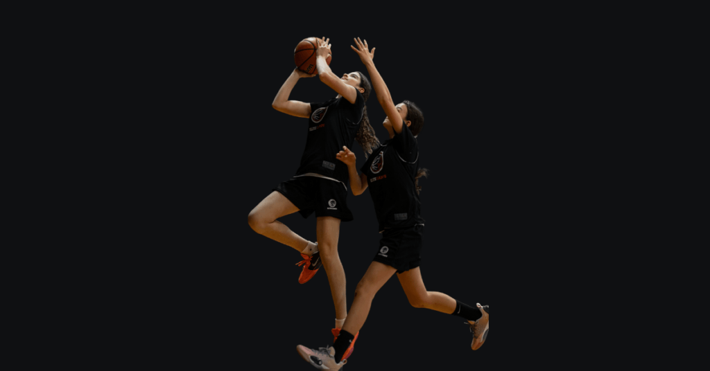 Female Basketball Players playing basketball